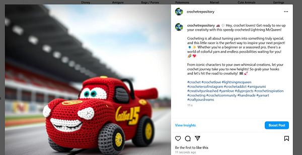 A crocheted toy version of Lightning McQueen is displayed on a racetrack background.