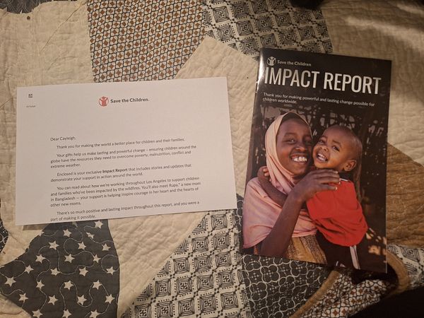 The image features a letter and an impact report from Save the Children, placed on a patterned quilt.