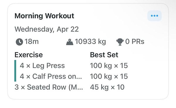 A woman exercises on a stairmaster machine in a gym environment.