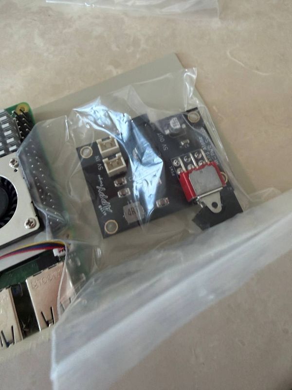 The image features electronic components related to a Raspberry Pi setup.