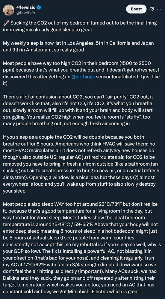 A screenshot of a tweet by levelsio discussing the impact of CO2 on sleep quality with a nighttime image of a person sleeping.