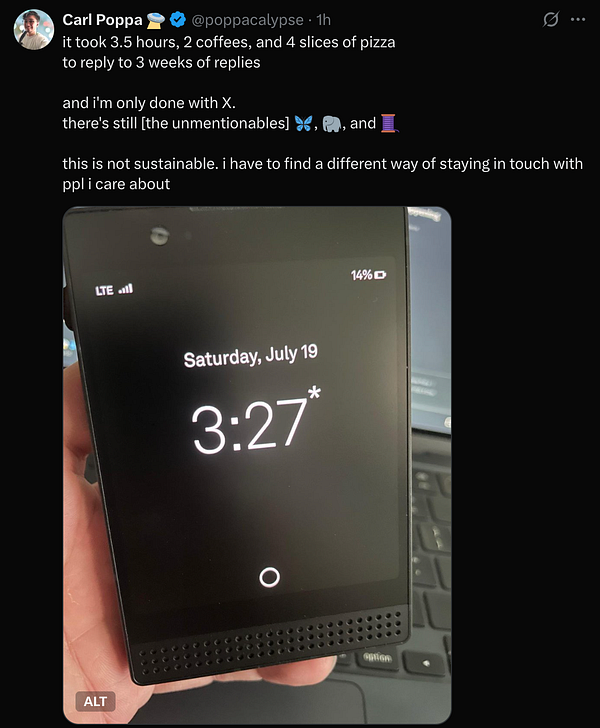 A smartphone displaying the time and date while being held in a person's hand.
