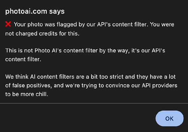 A notification from photoai.com indicating that a photo was flagged by an API content filter.