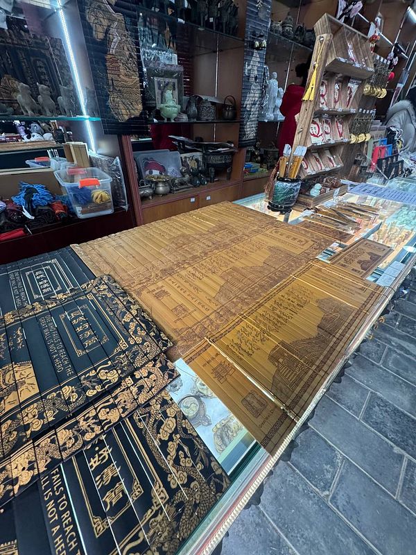 A display of traditional Chinese art and crafts in a shop.
