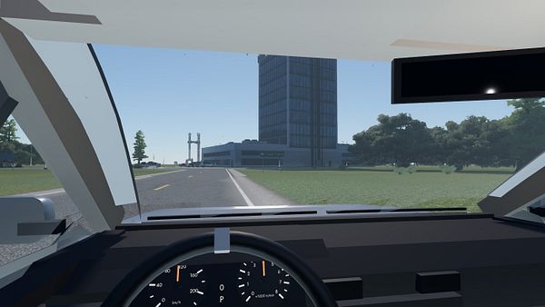 First-person view from inside a car driving on a road towards a tall building and a smaller structure resembling a bridge in a virtual environment.