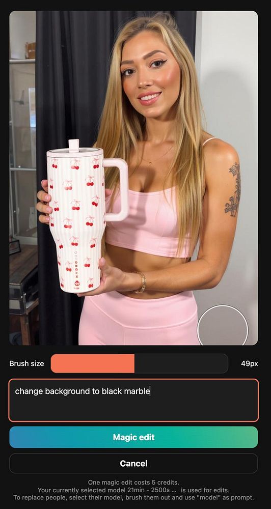 A woman holds a decorative drink container while using a photo editing interface on her device.