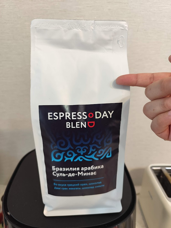 A scenic early morning pathway flanked by lush green trees with a sunbeam illuminating the path.