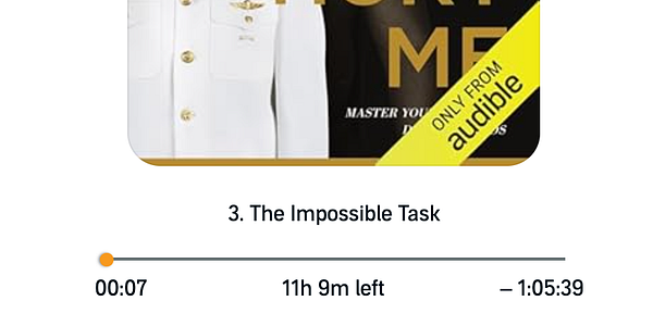 Close-up of a person holding an open book focused on reading chapter 3 with visible text paragraphs.