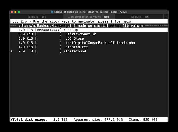 The image displays a terminal interface showing the progress of a 1TB backup of a VPS server to a laptop using the ncdu tool.
