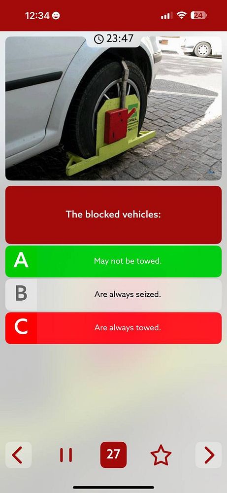 A car with a wheel clamp is parked on a street, accompanied by a quiz interface about blocked vehicles.
