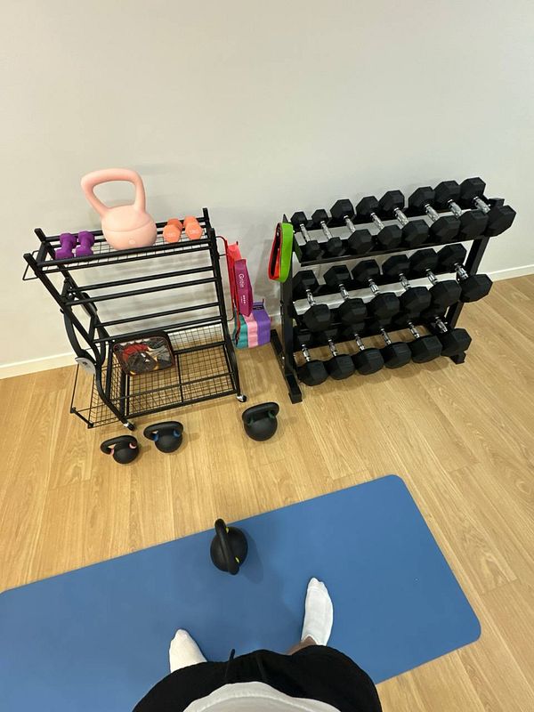 A home gym setup featuring various workout equipment.