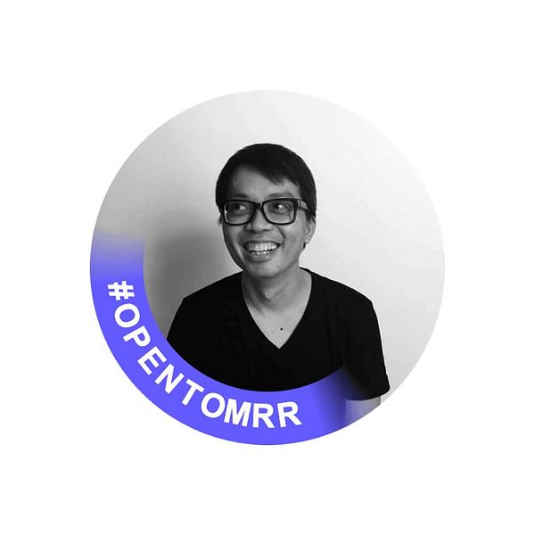 A profile avatar featuring a smiling individual with glasses against a simple background.