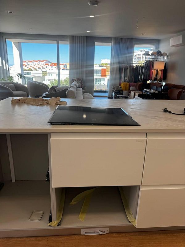 A kitchen countertop installation is shown, highlighting issues with the fit and surrounding decor.