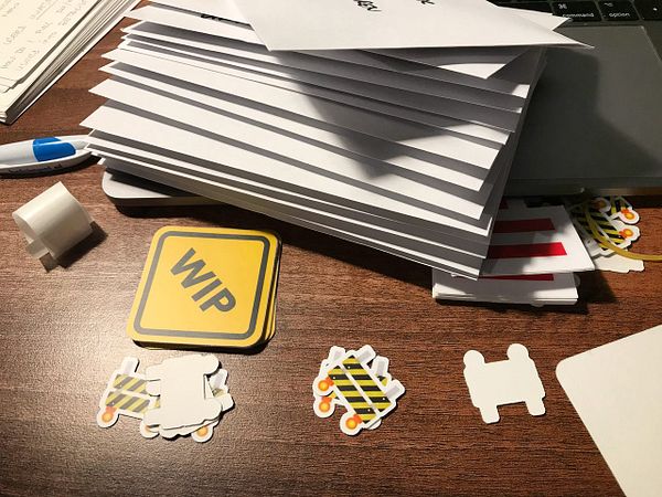 A workspace featuring sticker envelopes and various decorative stickers.