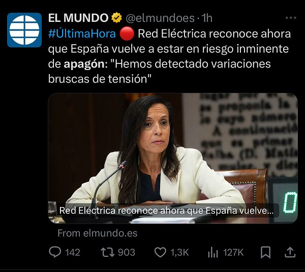 A woman speaks at a press conference regarding Spain's imminent risk of power outages.