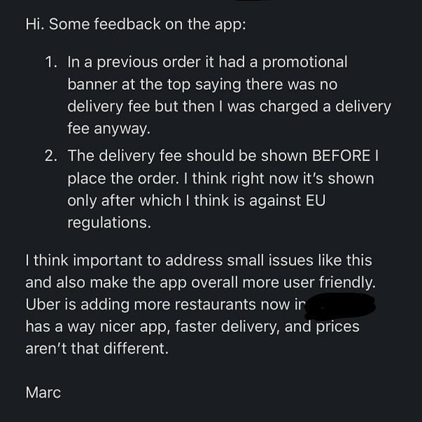 A user provides feedback on a food delivery app, highlighting issues with delivery fees and user experience.