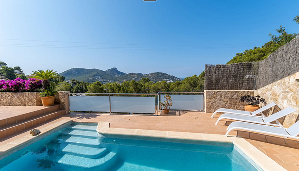 A luxurious villa with a private pool and stunning mountain views.