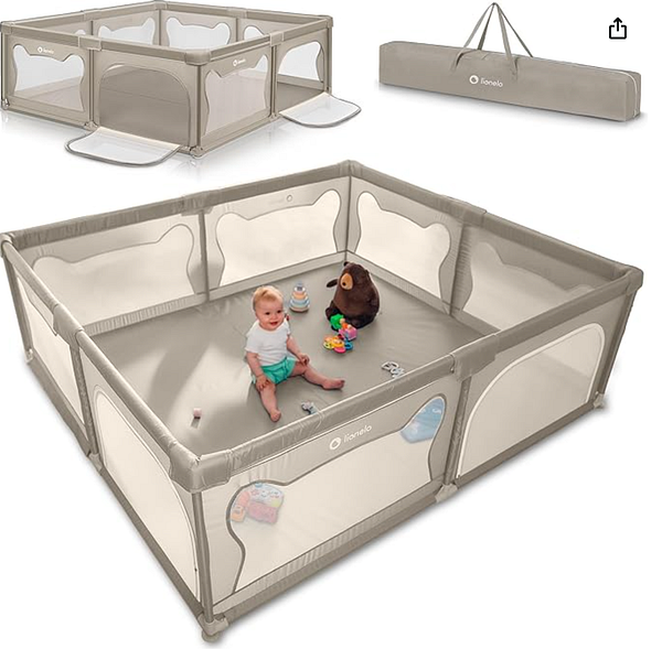 A woman is sitting on the grass in a park with a smiling baby and her laptop, enjoying an outdoor coding session.