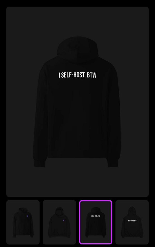A black hoodie featuring the text 'I SELF-HOST, BTW' on the back.