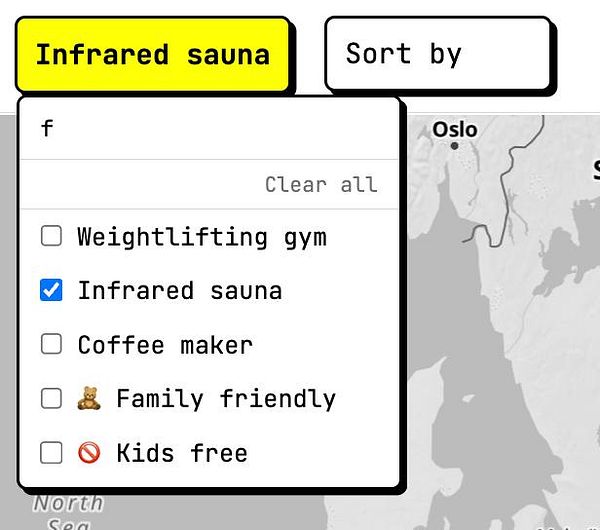 A user interface design for a hotel amenities selector with a searchable dropdown and checkbox options.
