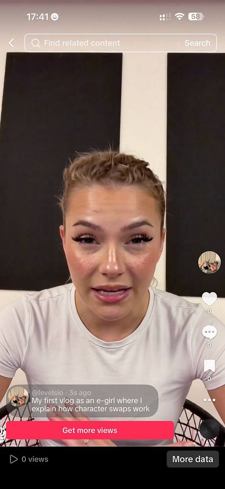 Portrait of an elderly woman with gray hair and prominent wrinkles wearing a leopard-print outfit and a delicate necklace against a plain peach background.