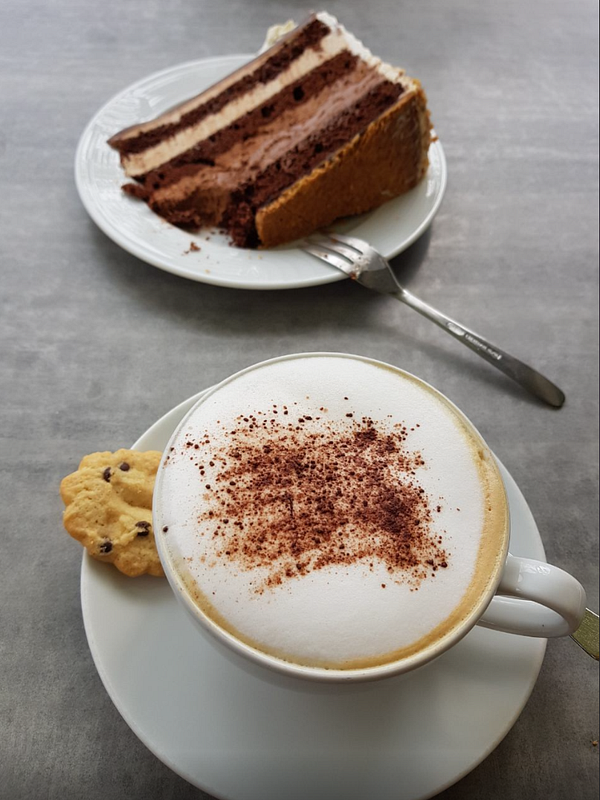 A delicious coffee and dessert setup at a café.