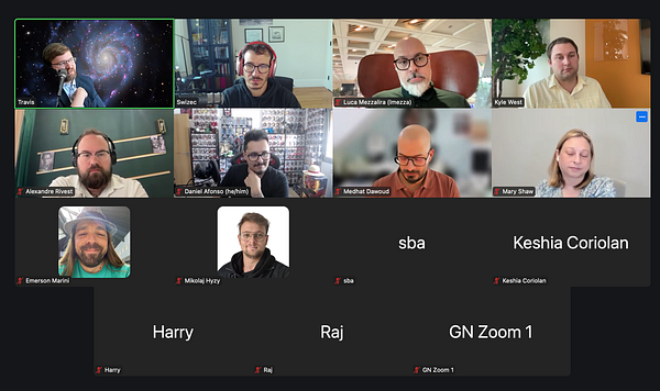 A virtual meeting featuring multiple participants discussing topics related to a React summit.