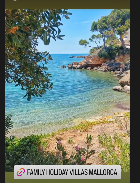 A serene coastal view featuring clear blue waters and rocky shores.