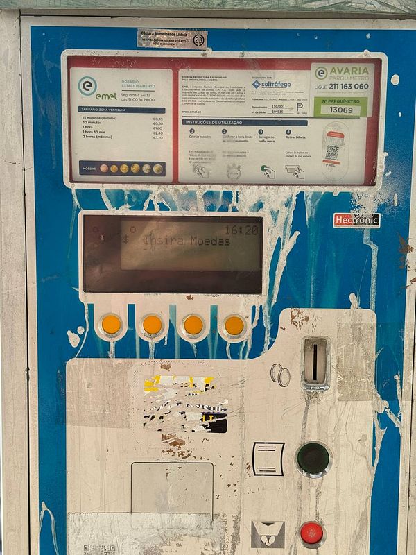 A parking meter in Lisbon that only accepts coins for payment.