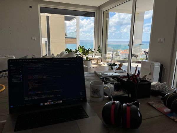 A remote coworking setup with a view of the ocean.