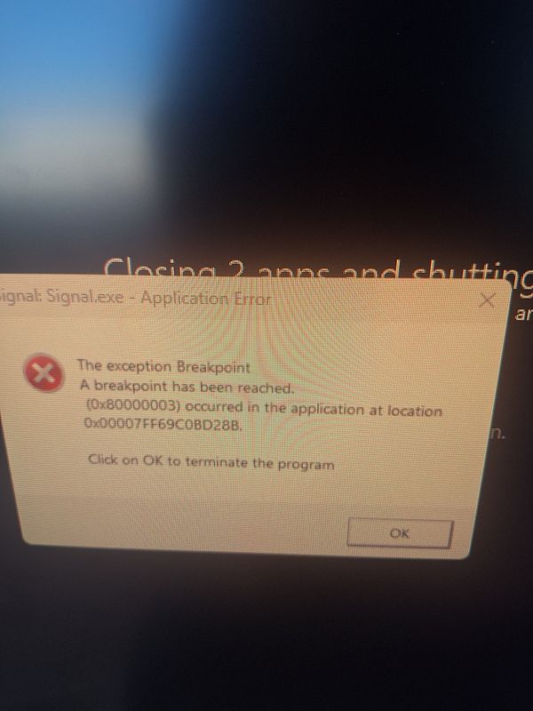 An error message from the Signal application indicating a breakpoint exception.