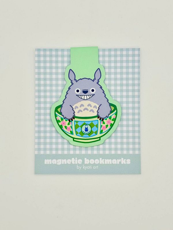 A colorful magnetic bookmark featuring a cartoon character in a bowl design.