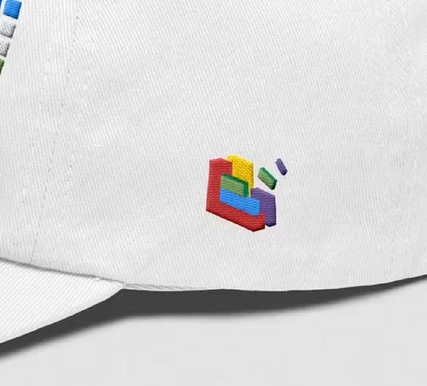A white cap featuring a colorful embroidered design.