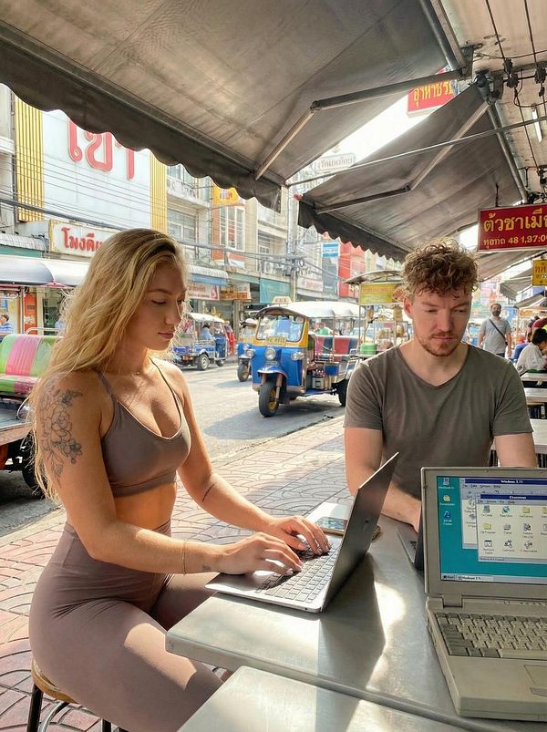 A digital artwork features a young man in a futuristic setting with a stylized character, vibrant neon colors, and detailed lighting effects.