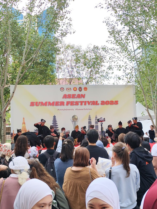 A vibrant scene from the ASEAN Summer Festival 2025 featuring a cultural performance with a diverse audience.