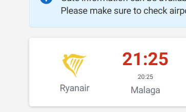 A nighttime photograph taken from inside a vehicle shows rain droplets on the windshield, with blurred and streaked light from streetlights and cars in stormy weather conditions.