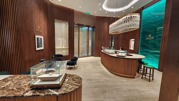 A luxurious interior of a new Rolex boutique featuring elegant design elements.