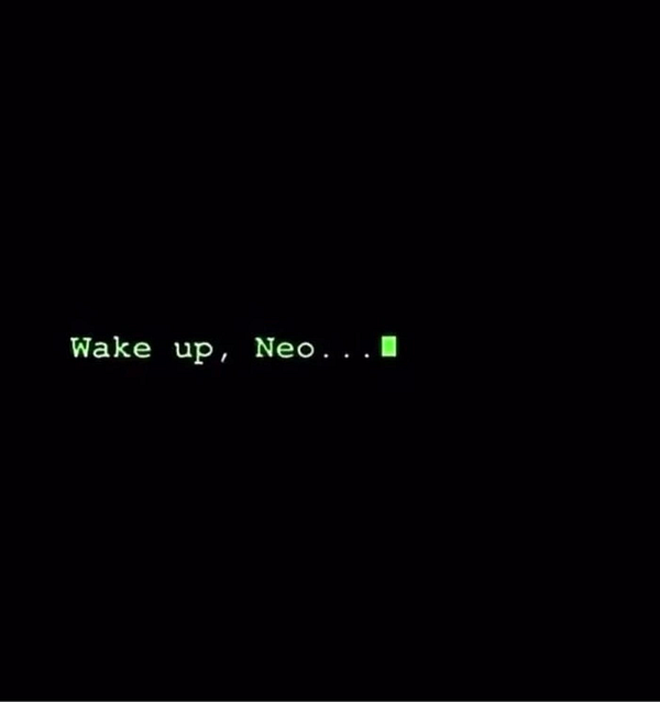 A green text message on a black background prompts someone named Neo to wake up.