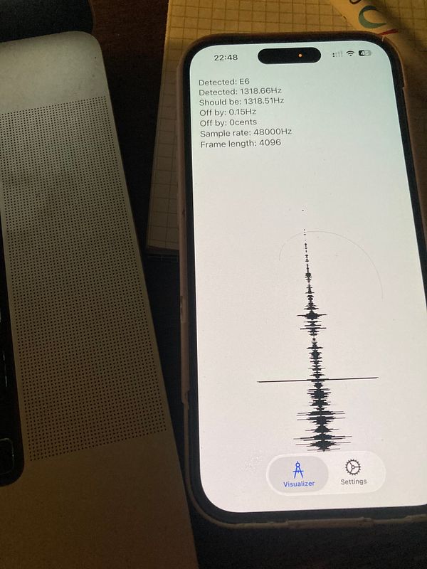 Screenshot of an Android Studio interface displaying Kotlin source code for playing a sine wave tone using AudioTrack.