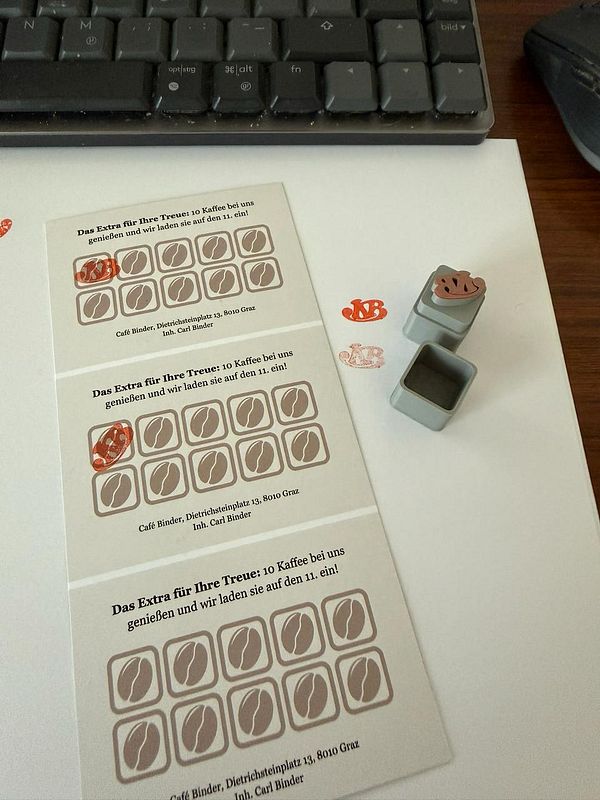 A 3D printed stamp and a hand-stamped card with intricate geometric patterns and text.