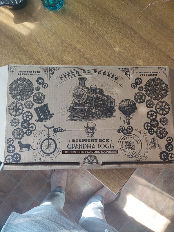 A creatively designed pizza delivery box featuring vintage elements and a whimsical theme.