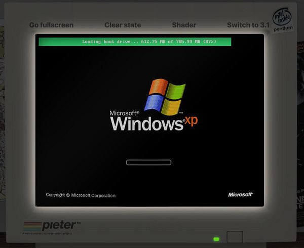 A screenshot of a Windows XP logon background featuring the iconic Bliss wallpaper from the Windows XP setup process with the login prompt visible.