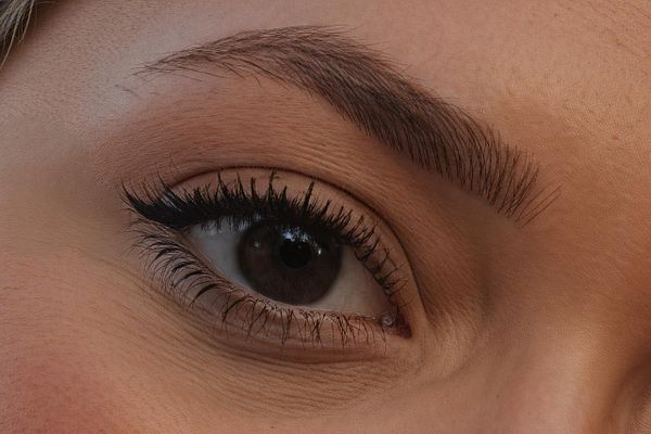 A close-up of a human eye with detailed features.