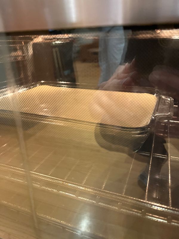 A cheesecake is baking in an oven.