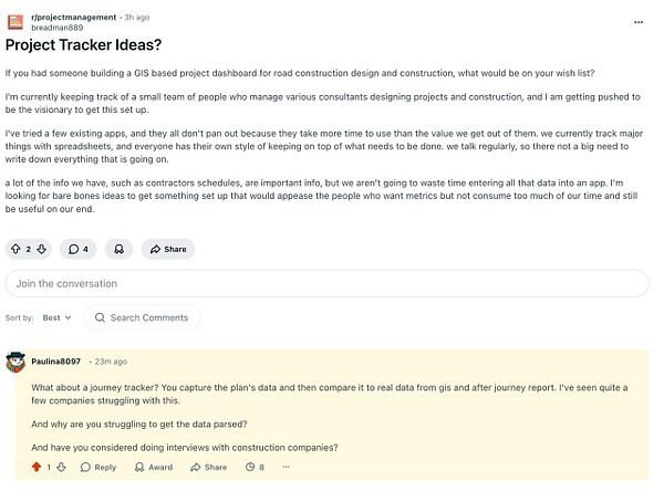 Group of unusual rock formations on a grassy coastline under a cloudy sky.