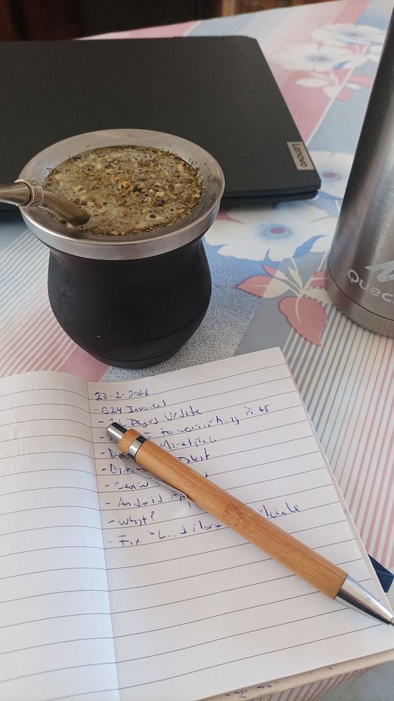 A vibrant street scene in Buenos Aires with colorful graffiti art and a small gathering of people near a wooden window.