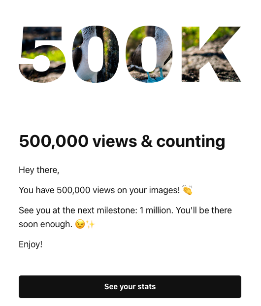 A celebratory notification about reaching 500,000 views on Unsplash images.
