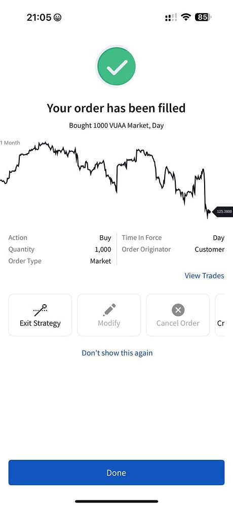 A trading app interface confirming a filled order for purchasing shares.