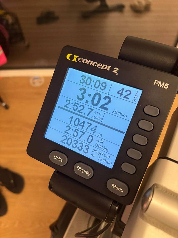 The image displays a Concept2 rowing machine monitor showing workout statistics.