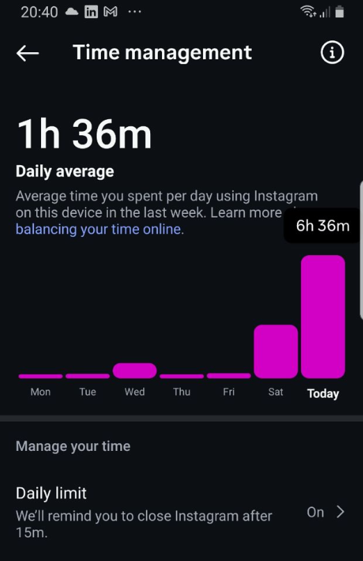 A colorful birthday cake with Hello Kitty decoration and multiple lit candles.